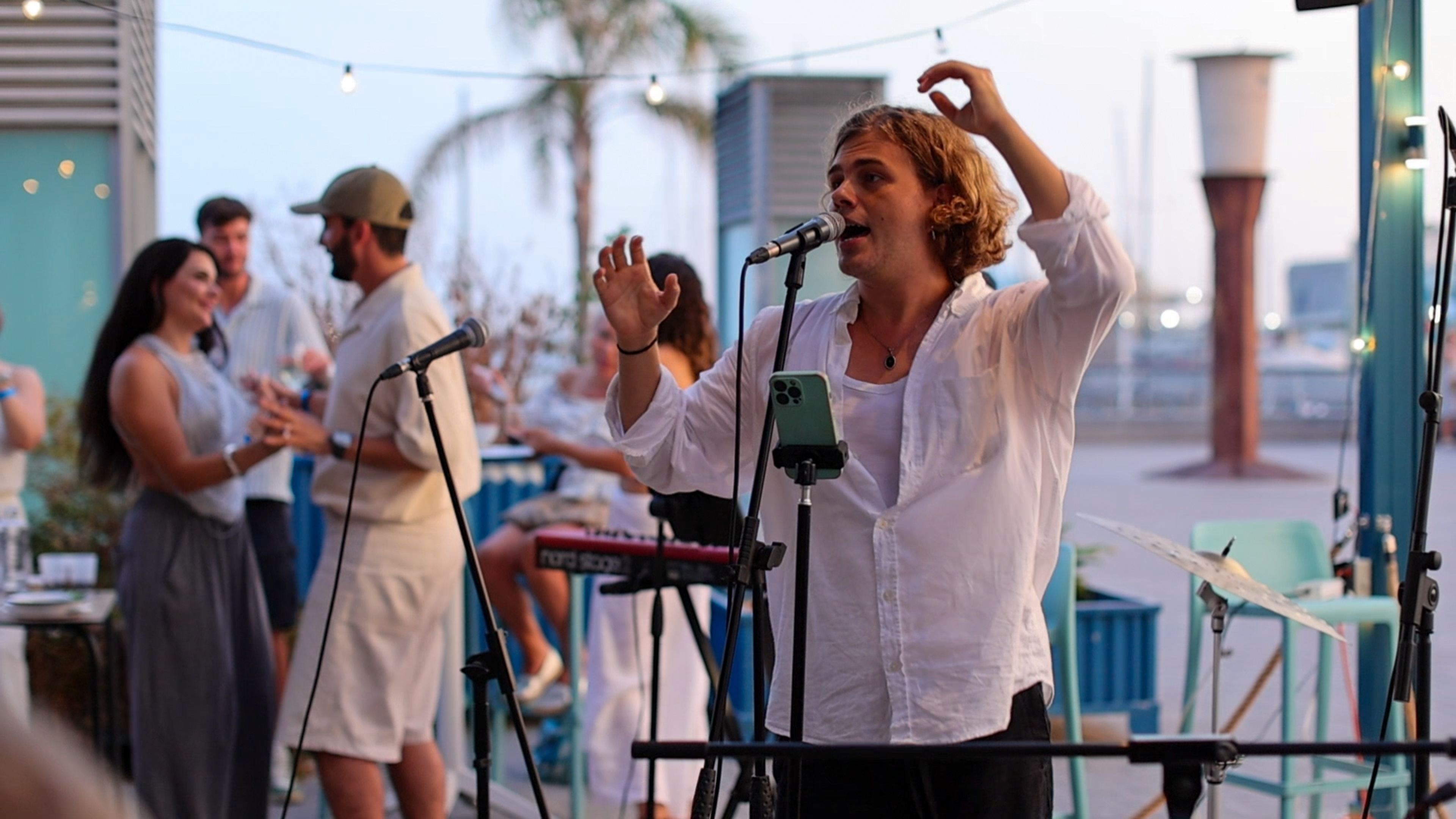 Live singing at golden hour by the marina